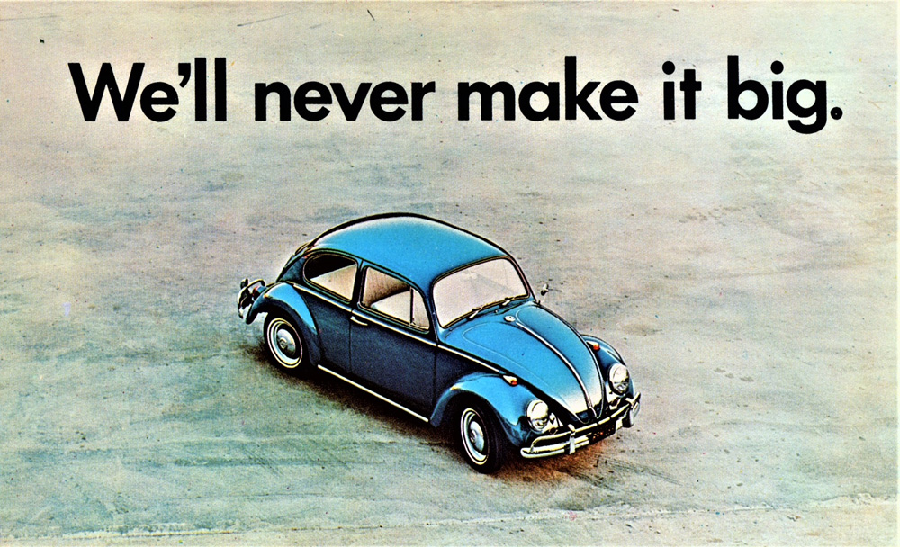 From a famous advertising campaign for the Volkswagen Beetle, featuring a car positioned in a vast, empty space to contrast with the text "We'll never make it big". 