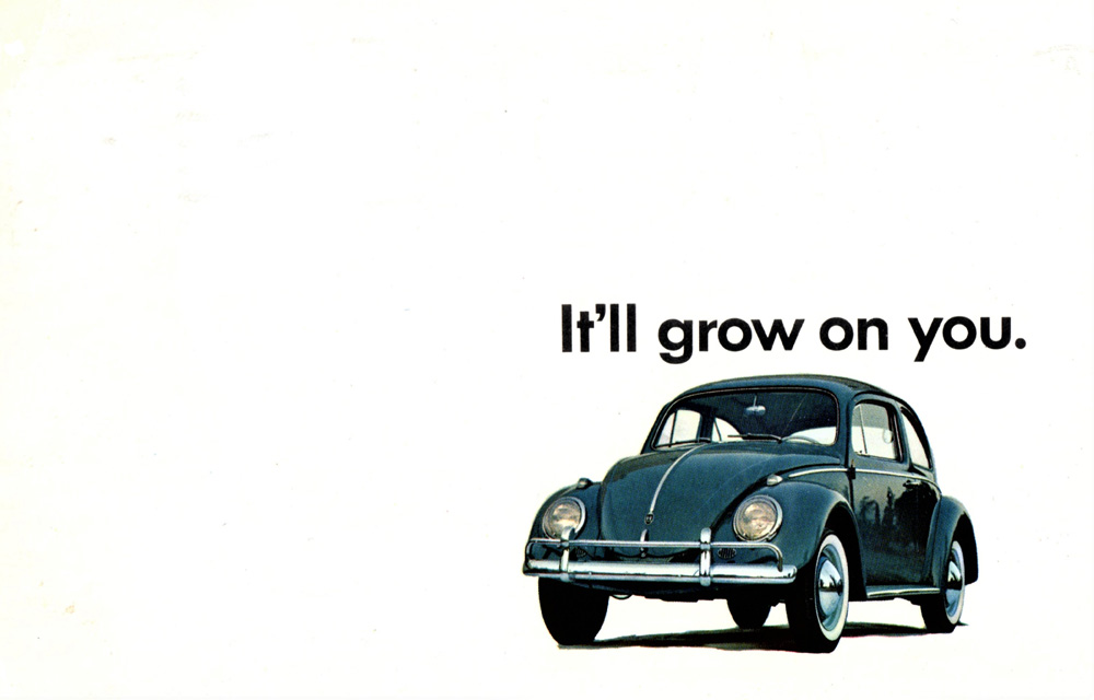 A vintage advertisement for the Volkswagen Beetle featuring the tagline "It'll grow on you." It is known for its distinctive design, affordability, and simple engineering. This specific ad campaign for Volkswagen is famous for its minimalist and honest advertising style. 