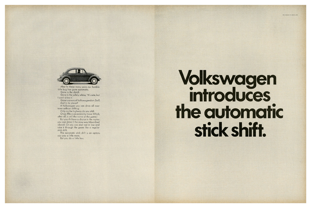 A vintage two-page print advertisement from 1968 for the Volkswagen Beetle, introducing the "Automatic Stick Shift" option. The main feature highlighted is that the manual clutch pedal has been removed, making city driving easier. Shifting is still required on the highway, but only once. The automatic stick shift was offered as an option for a higher price compared to the standard manual transmission. 