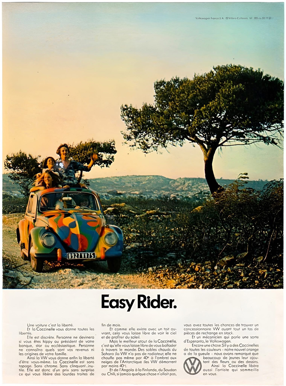 Vintage Volkswagen Beetle advertisement with a colorful painted Beetle on a scenic road