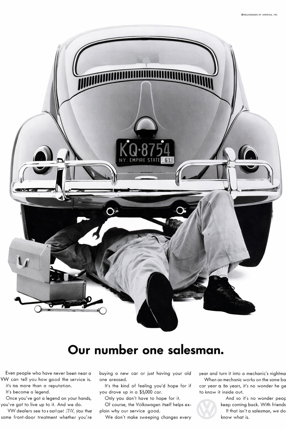 Vintage VW ad showing a mechanic working under a Beetle, emphasizing Volkswagens trusted service reputation