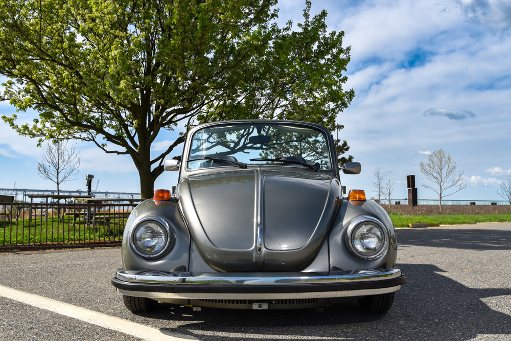 1979 Volkswagen Super Beetle convertible parked outdoors with the top down