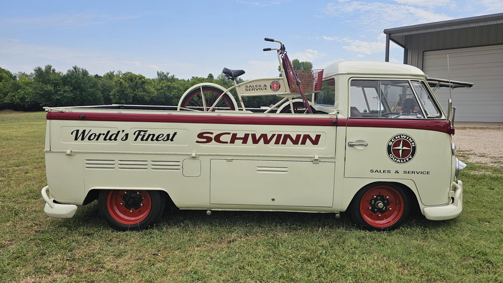Vintage VW Single Cab carrying a classic Schwinn bicycle in the bed near a building