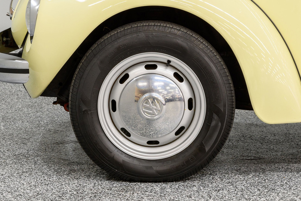 Yellow Super Beetle with original wheels and hubcaps