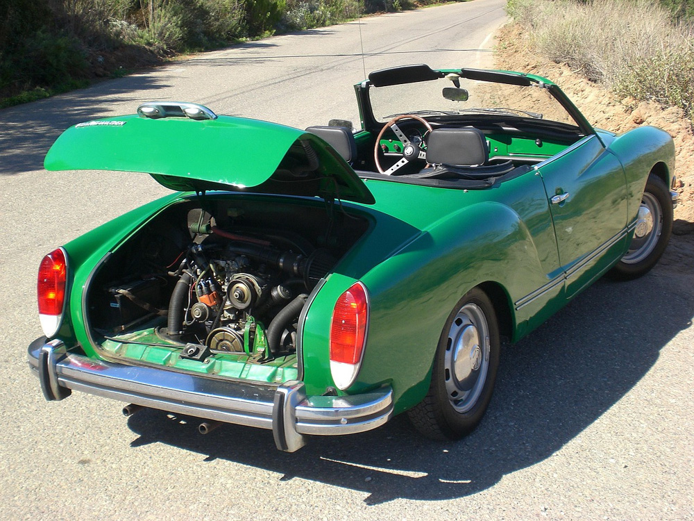 Restored Karmann Ghia with polished chrome trim and rounded body lines