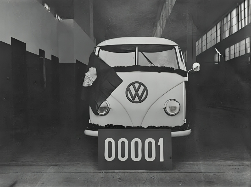 First air cooled Volkswagen Kombi produced in Brazil displayed inside the factory with a commemorative sign