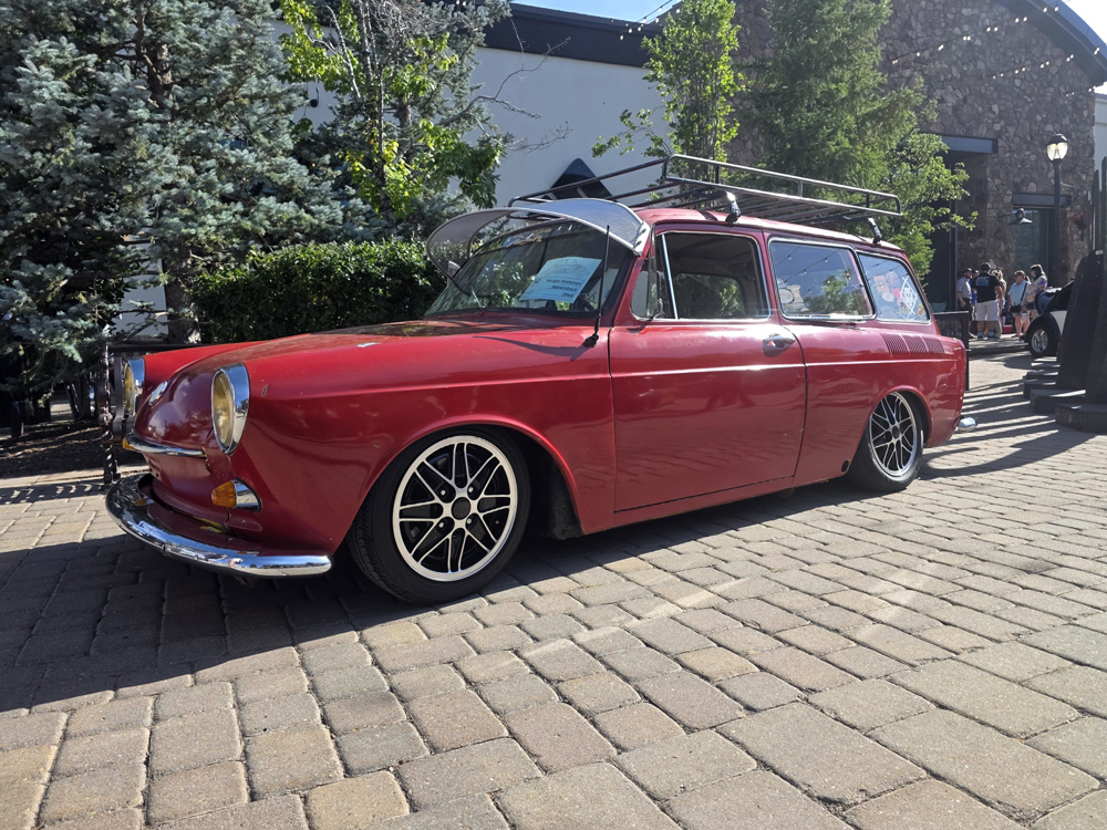 Modified red VW Type 3 Squareback with lowered stance and black wheels