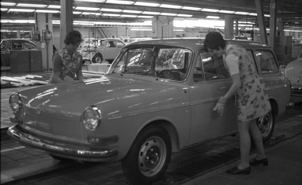 Two Wolfsburg factory workers installing the chrome trim on a 1973 Type 3 Variant, or Squareback at it is known by in North America.