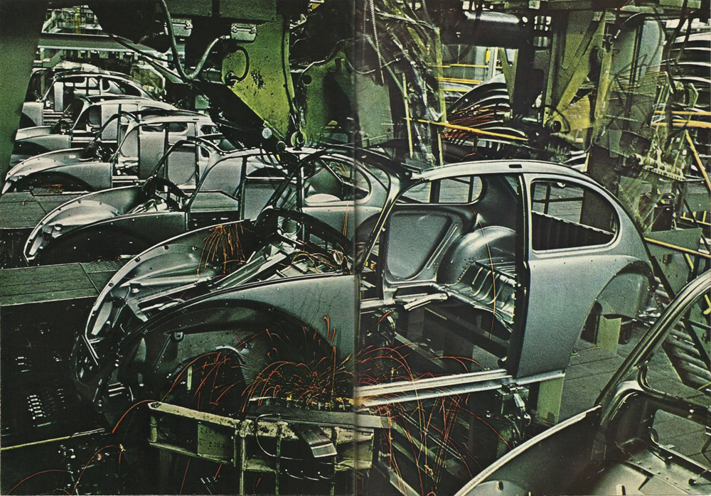 Sparks fly as Beetle bodyshells take shape during automated welding at Volkswagenwerk Wolfsburg in 1966.