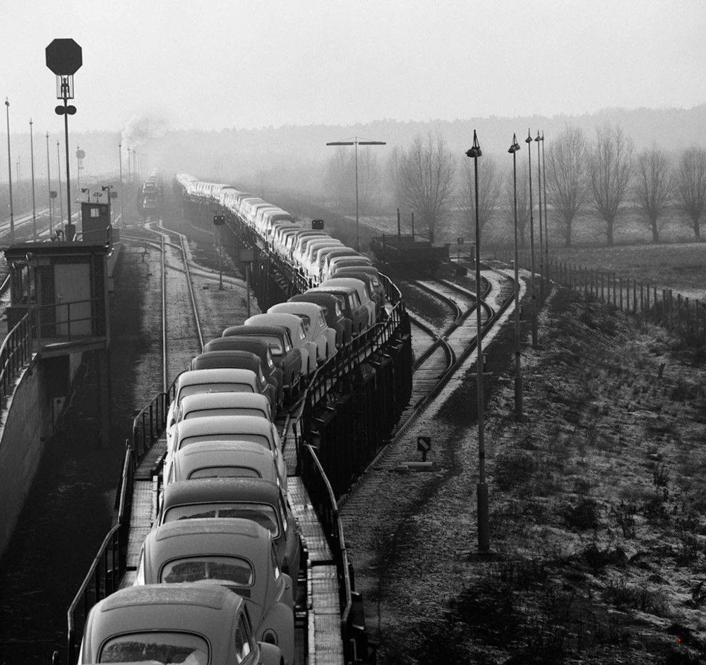 Heinrich Heidersbergers 1961 K&auml;ferzug photo showing a long train of new Volkswagen Beetles leaving the Wolfsburg factory