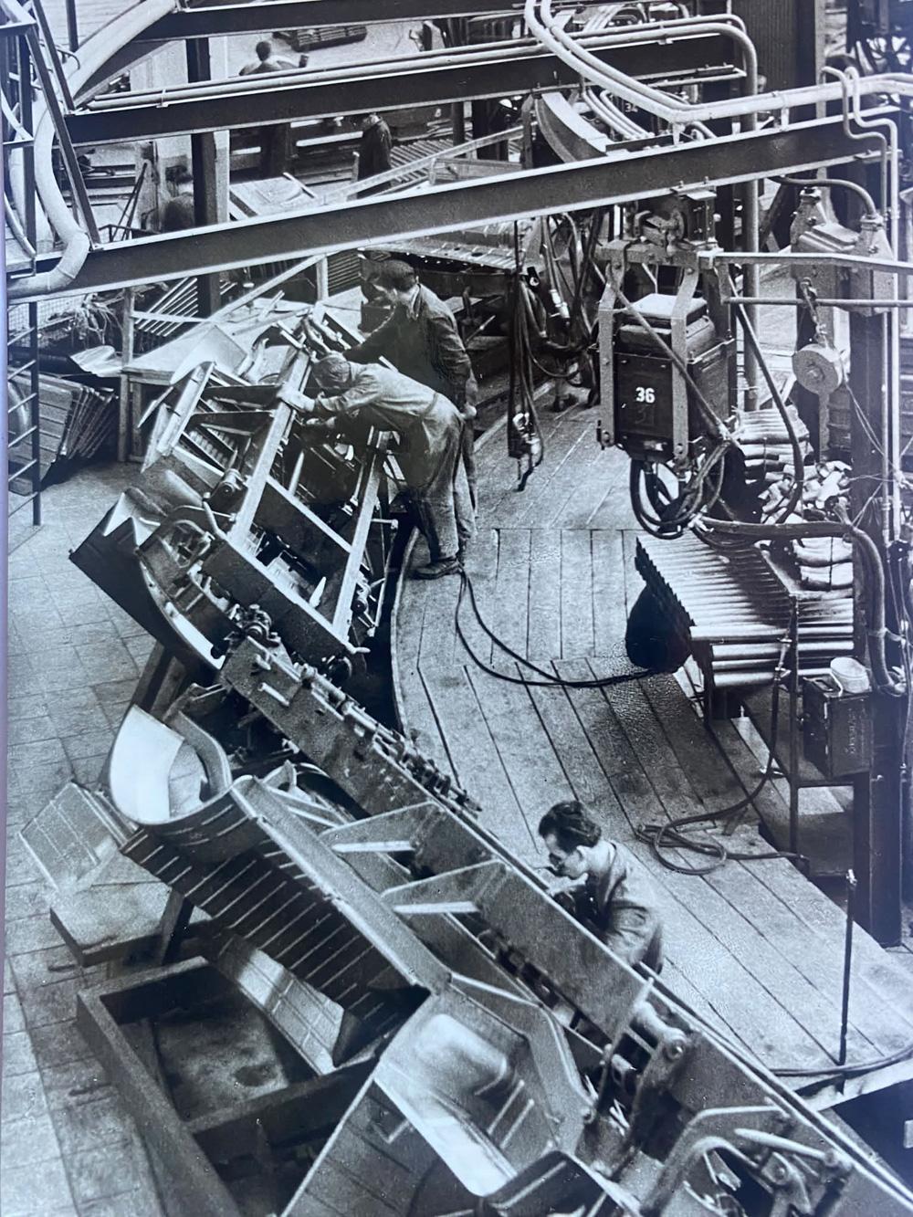Mechanized production line at VW Hanover van plant showing automated assembly machines.