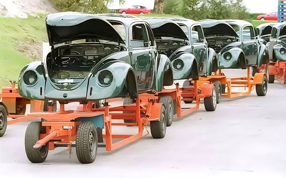 Metallic green Beetle bodies outside at Puebla plant in 2001 awaiting assembly.