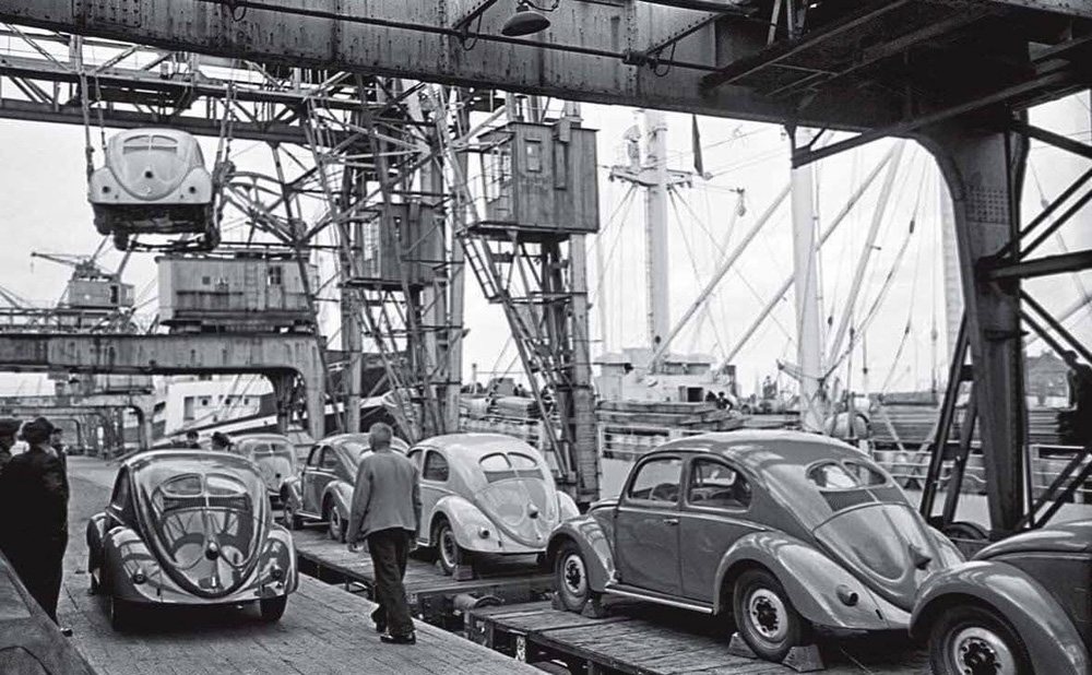 New Volkswagens at a German port in 1951 awaiting export with hubcaps and wipers stored inside.